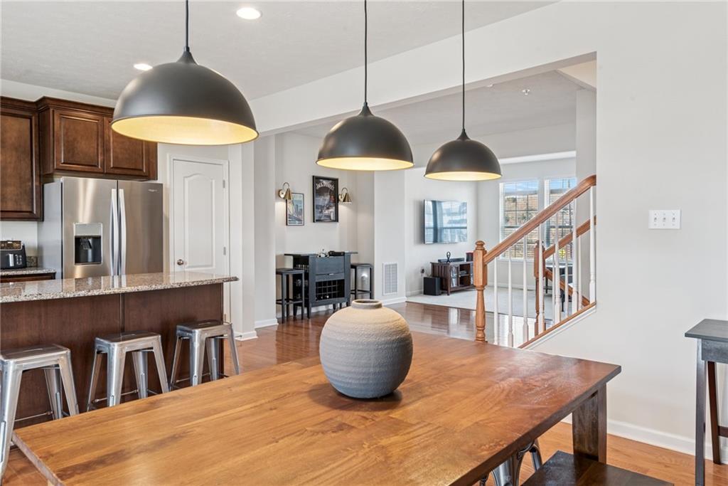 204 Eagle Drive Cranberry Township, PA 16066 - Photo 5 of 34 a dining room with furniture and a chandelier