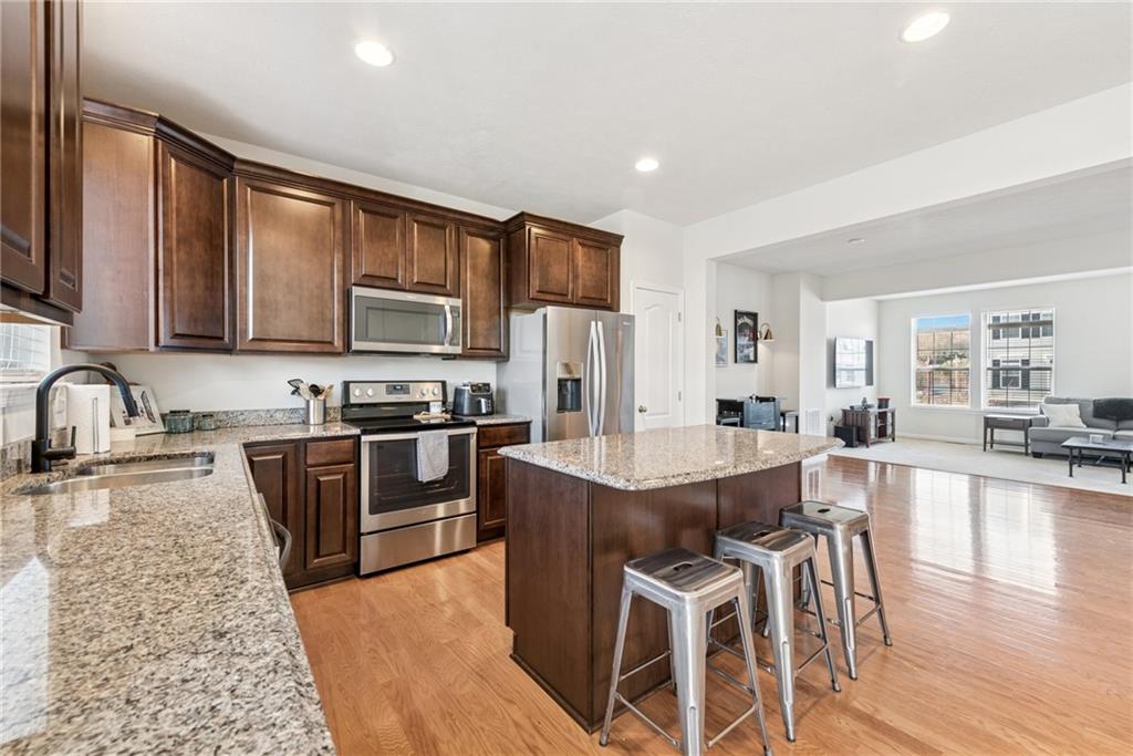 204 Eagle Drive Cranberry Township, PA 16066 - Photo 6 of 34 a large kitchen with granite countertop lots of counter top space and stainless steel appliances