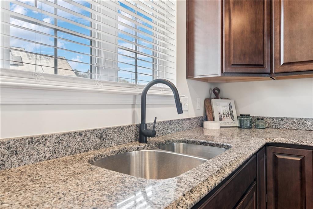 204 Eagle Drive Cranberry Township, PA 16066 - Photo 9 of 34 a kitchen with granite countertop a sink and a window