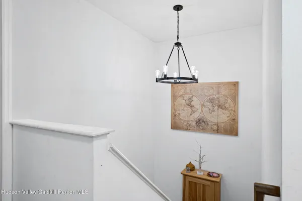 a view of a hallway with a refrigerator