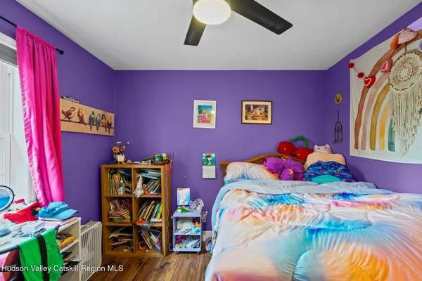 a bedroom with a bed and a couch