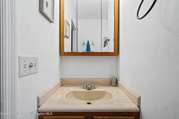 a bathroom with a sink and a window