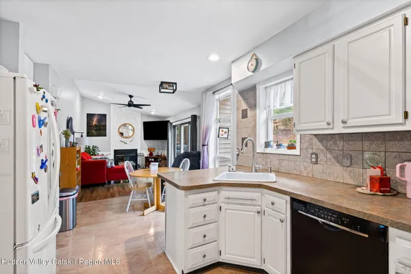 a kitchen with stainless steel appliances granite countertop a sink and cabinets