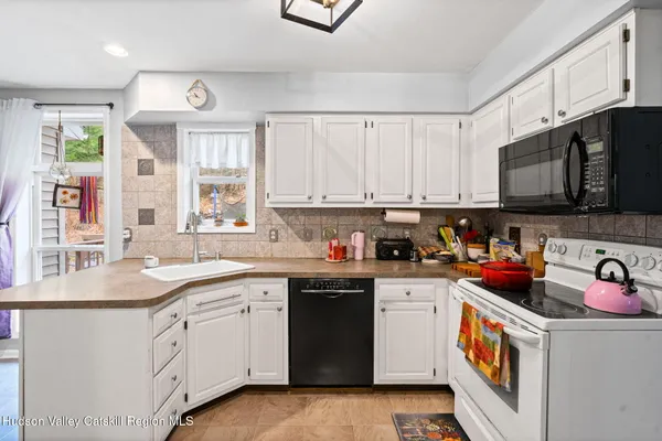a kitchen with stainless steel appliances granite countertop a sink and cabinets