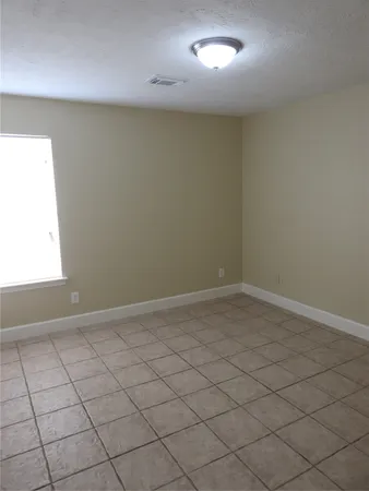 en empty room with windows