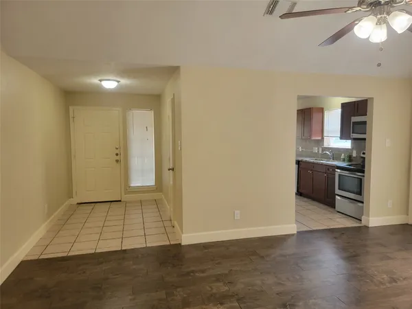 a view of a kitchen with a sink and a stove top oven