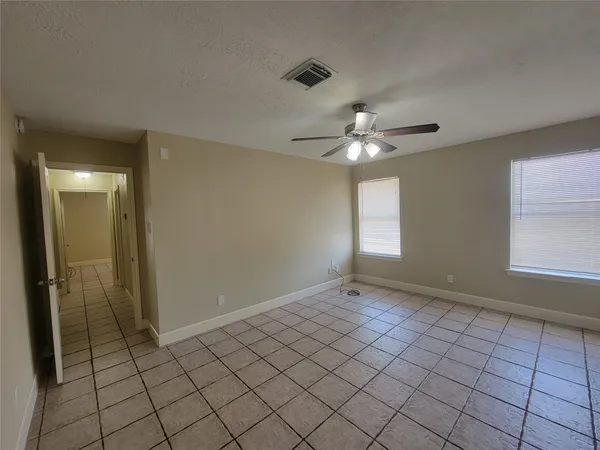 a view of an empty room and window