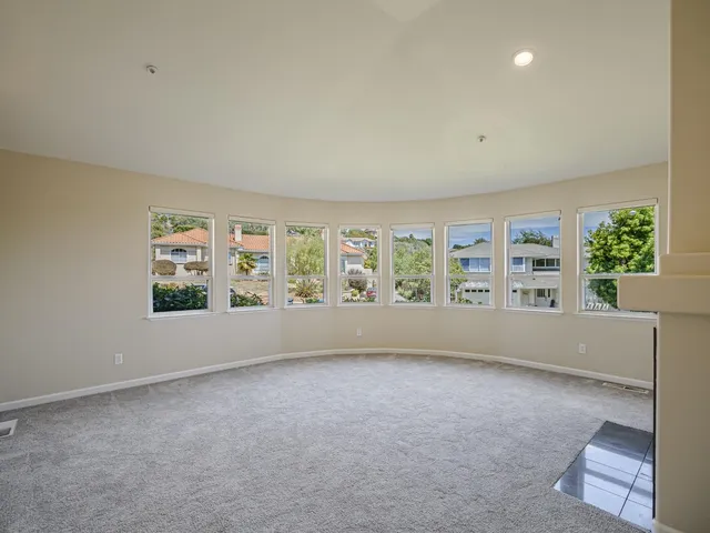 a kitchen with stainless steel appliances granite countertop a sink cabinets and wooden floor