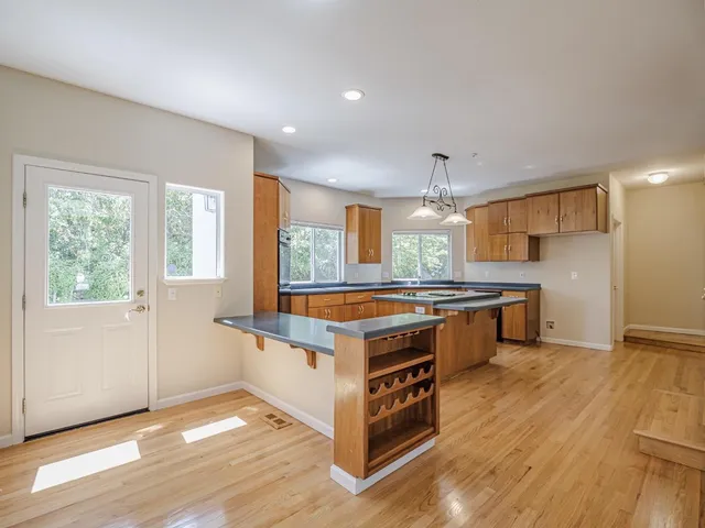 a view of an empty room and a window