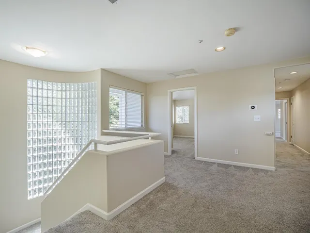 an aerial view of a house with a swimming pool