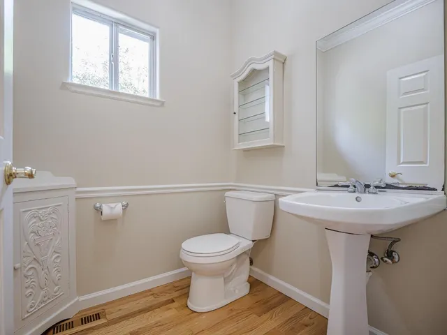 a view of a house with a garden and pathway