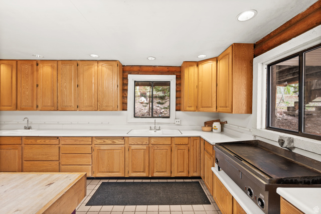 4725 Pine Ridge Road Evanston, UT 82930 - Photo 19 of 82 Kitchen featuring light wood cabinetry, white countertops, tile flooring, and recessed lighting