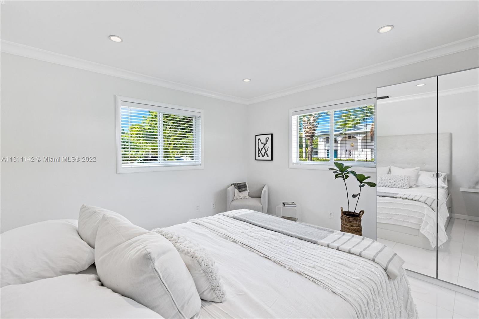 1314 Fillmore Street Hollywood, FL 33019 - Photo 26 of 47 a bedroom with a bed and a couch