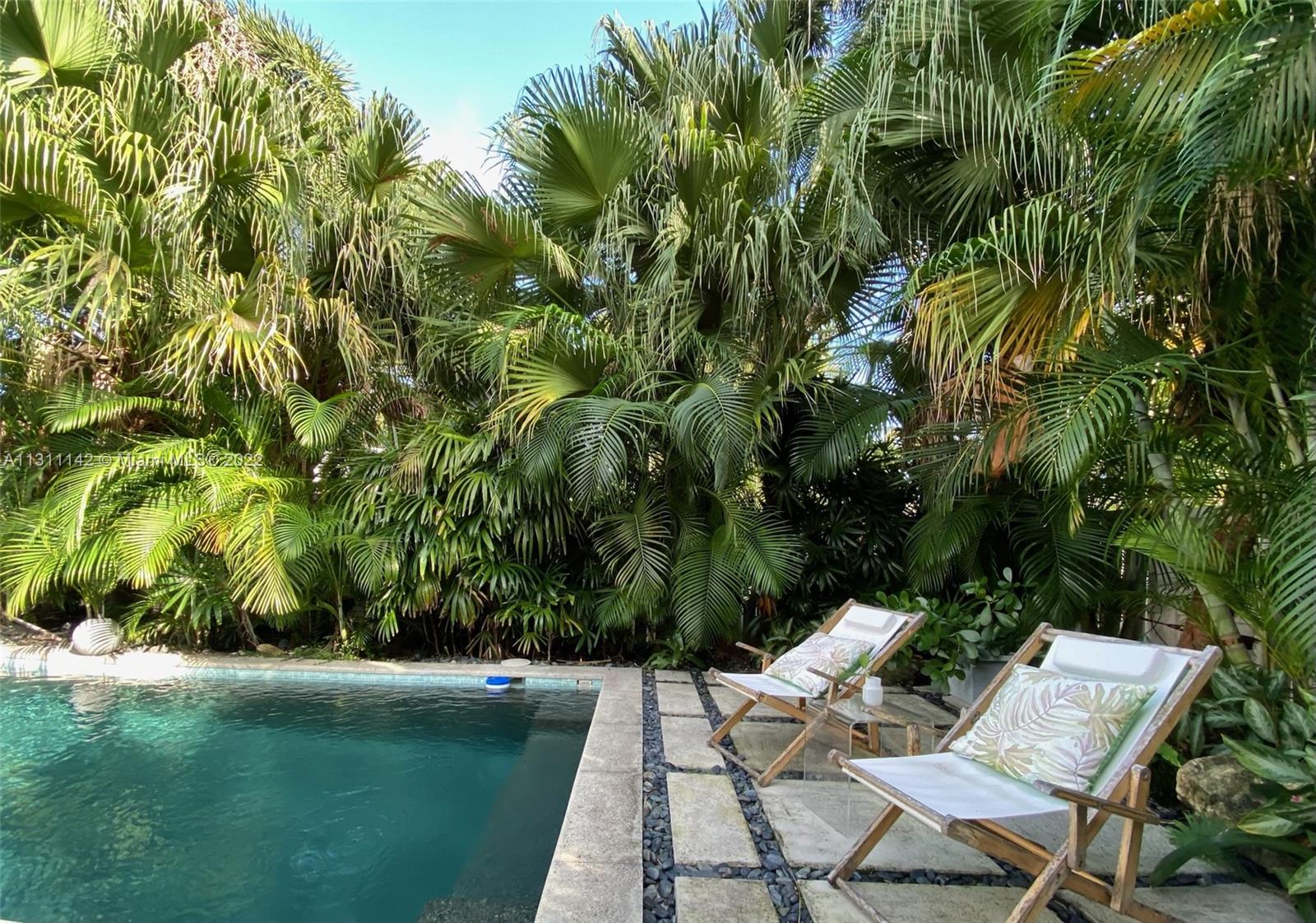 1314 Fillmore Street Hollywood, FL 33019 - Photo 34 of 47 a view of backyard with outdoor seating and green space