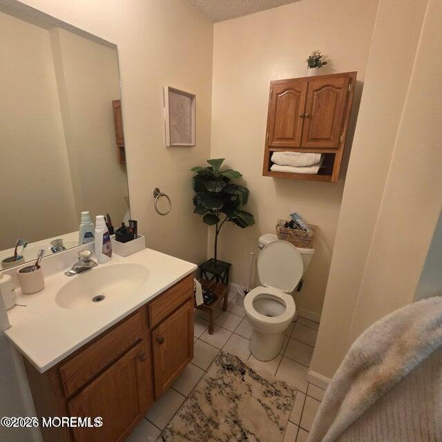 290 North Main Street, Unit D5 Barnegat, NJ 08005 - Photo 4 of 6 a bathroom with a sink toilet and a mirror