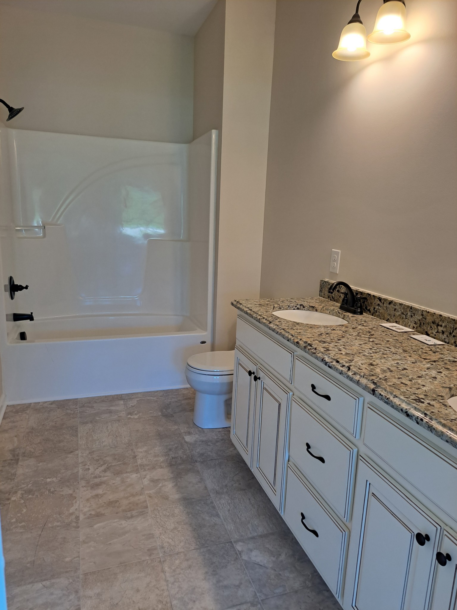 989 Carthage Road Red Boiling Springs, TN 37150 - Photo 16 of 19 a bathroom with a granite countertop sink and mirror