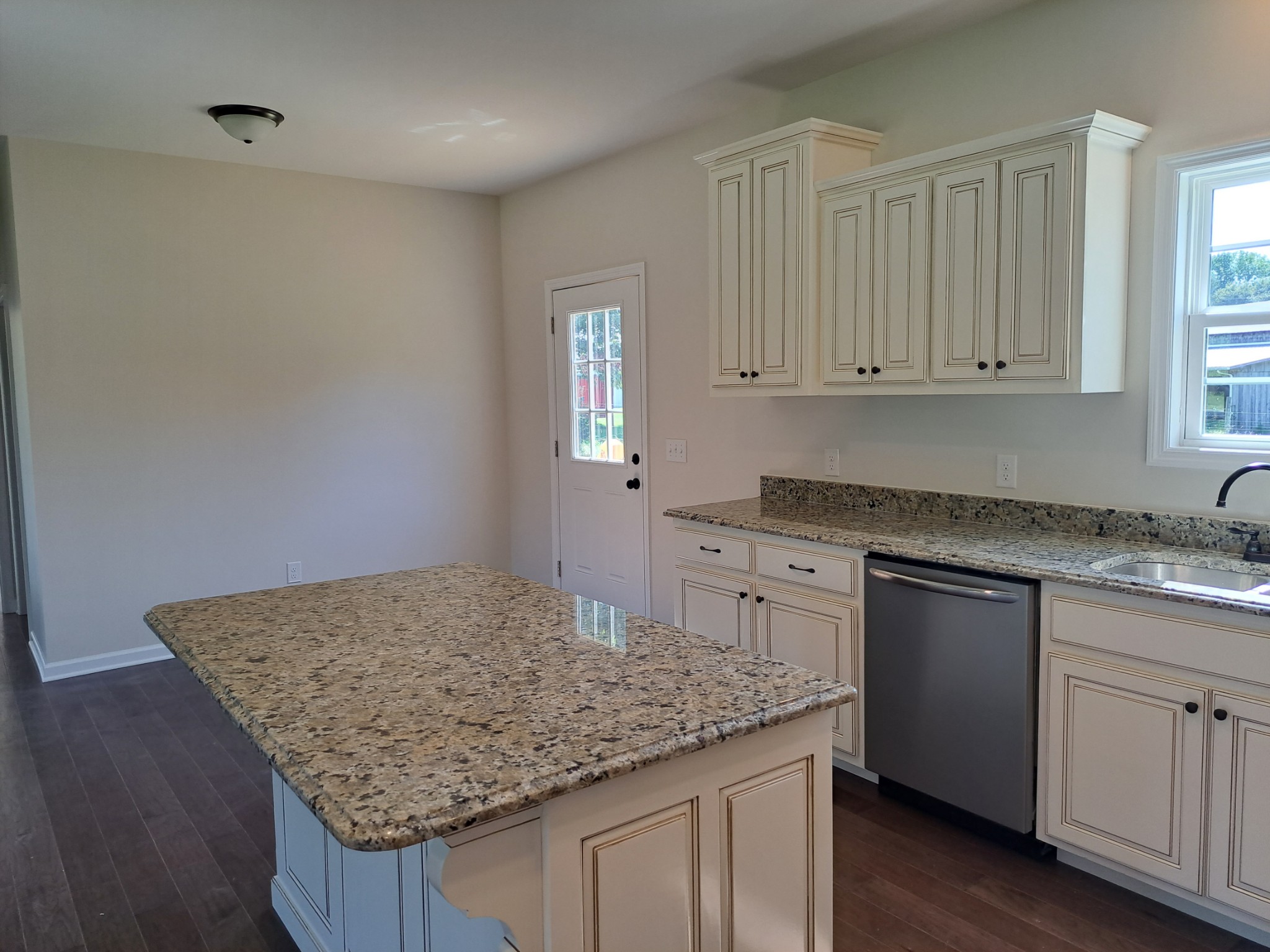 989 Carthage Road Red Boiling Springs, TN 37150 - Photo 8 of 19 a kitchen with granite countertop white cabinets and a granite counter tops