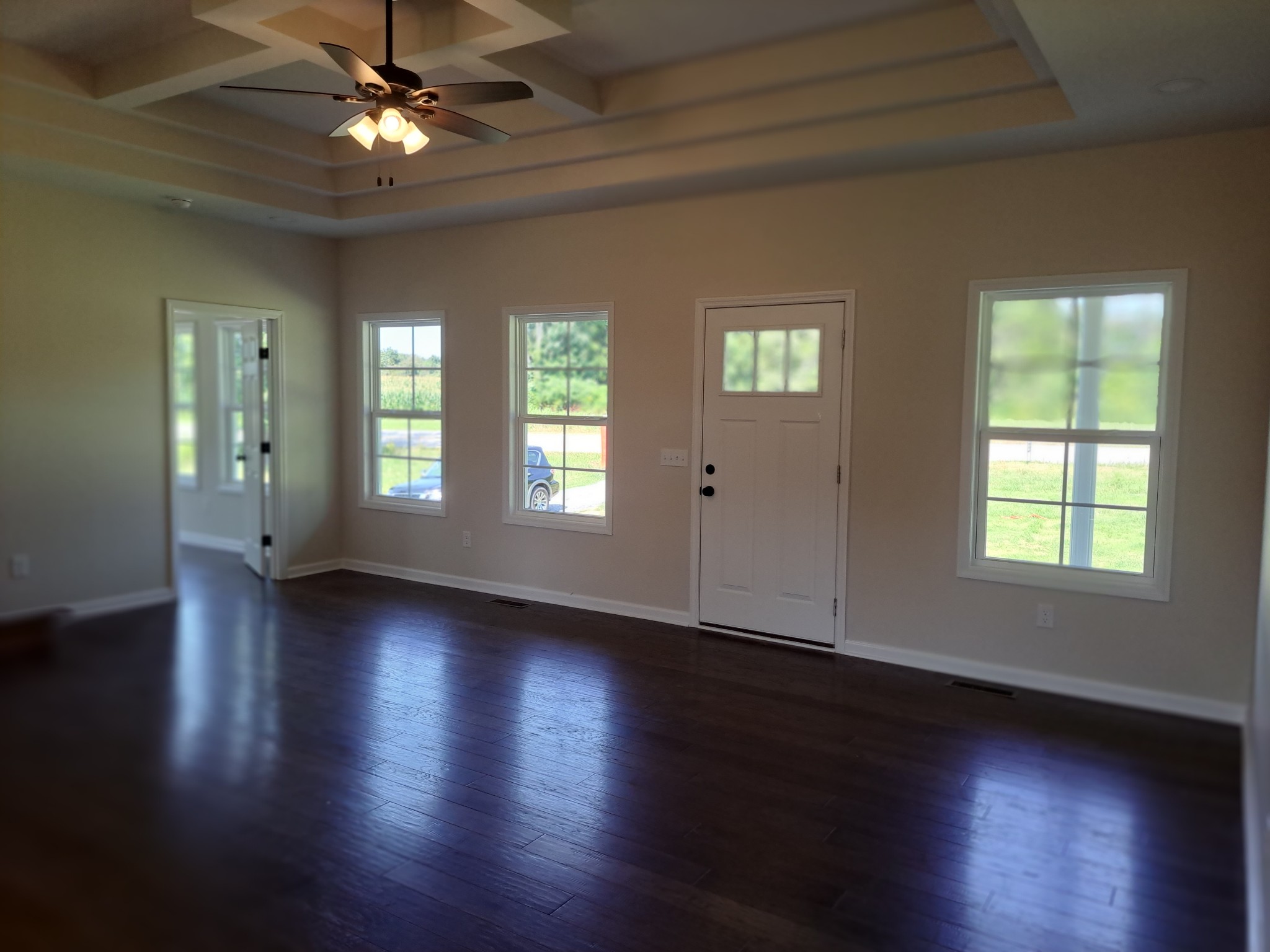 989 Carthage Road Red Boiling Springs, TN 37150 - Photo 10 of 19 a view of an empty room with wooden floor and a window