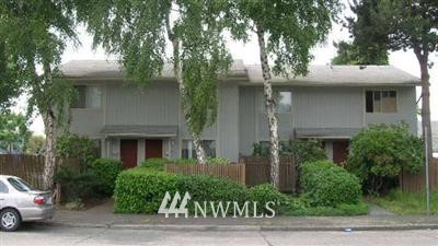 a view of a car parked in front of house