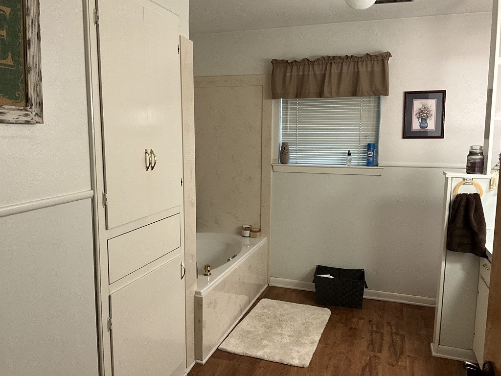 416 Division Street Jewett, TX 75846 - Photo 16 of 36 a bathroom with a bathtub and a shower