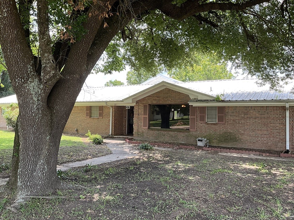 416 Division Street Jewett, TX 75846 - Photo 2 of 36 a front view of a house with a yard
