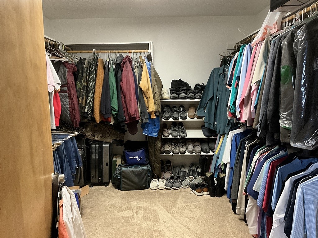416 Division Street Jewett, TX 75846 - Photo 23 of 36 a view of walk in closet with clothes and shoes