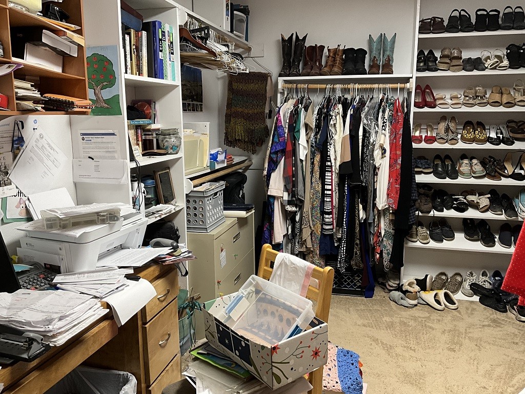 416 Division Street Jewett, TX 75846 - Photo 24 of 36 a view of walk in closet with clothes and shoes