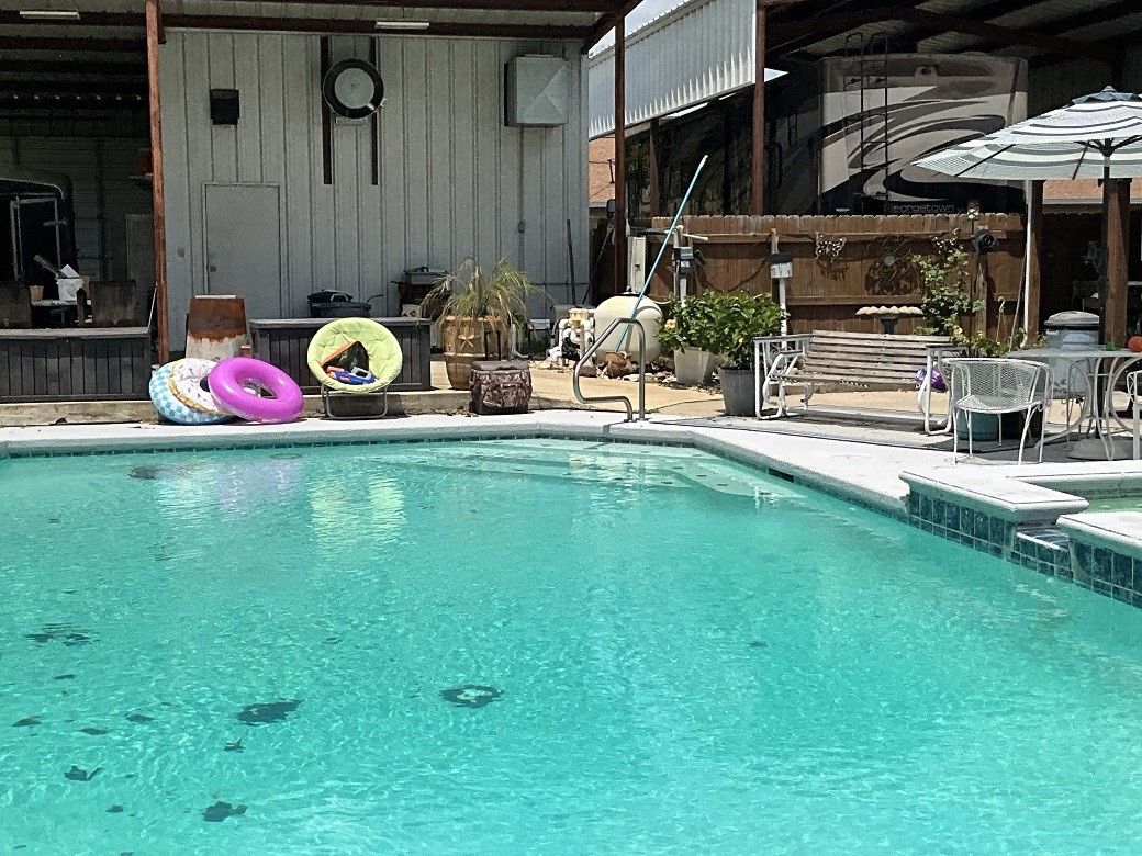 416 Division Street Jewett, TX 75846 - Photo 25 of 36 swimming pool view with a outdoor seating