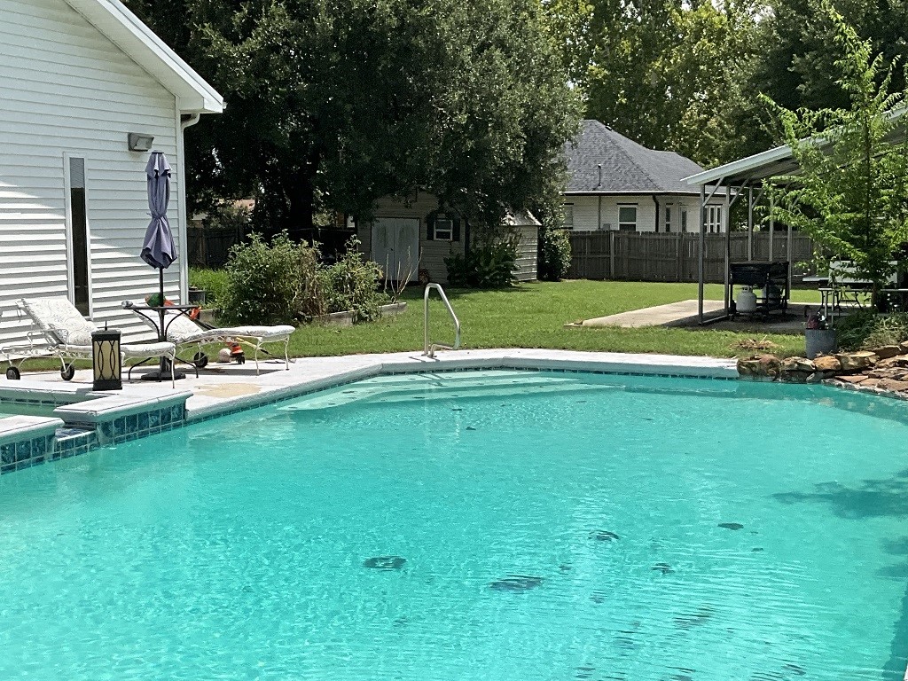 416 Division Street Jewett, TX 75846 - Photo 27 of 36 a view of a house with a big yard patio and swimming pool