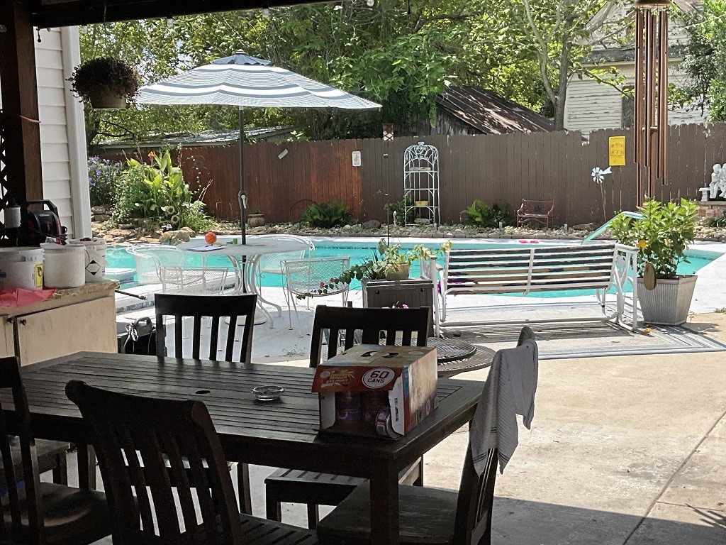 416 Division Street Jewett, TX 75846 - Photo 28 of 36 a view of a table and chairs in the patio