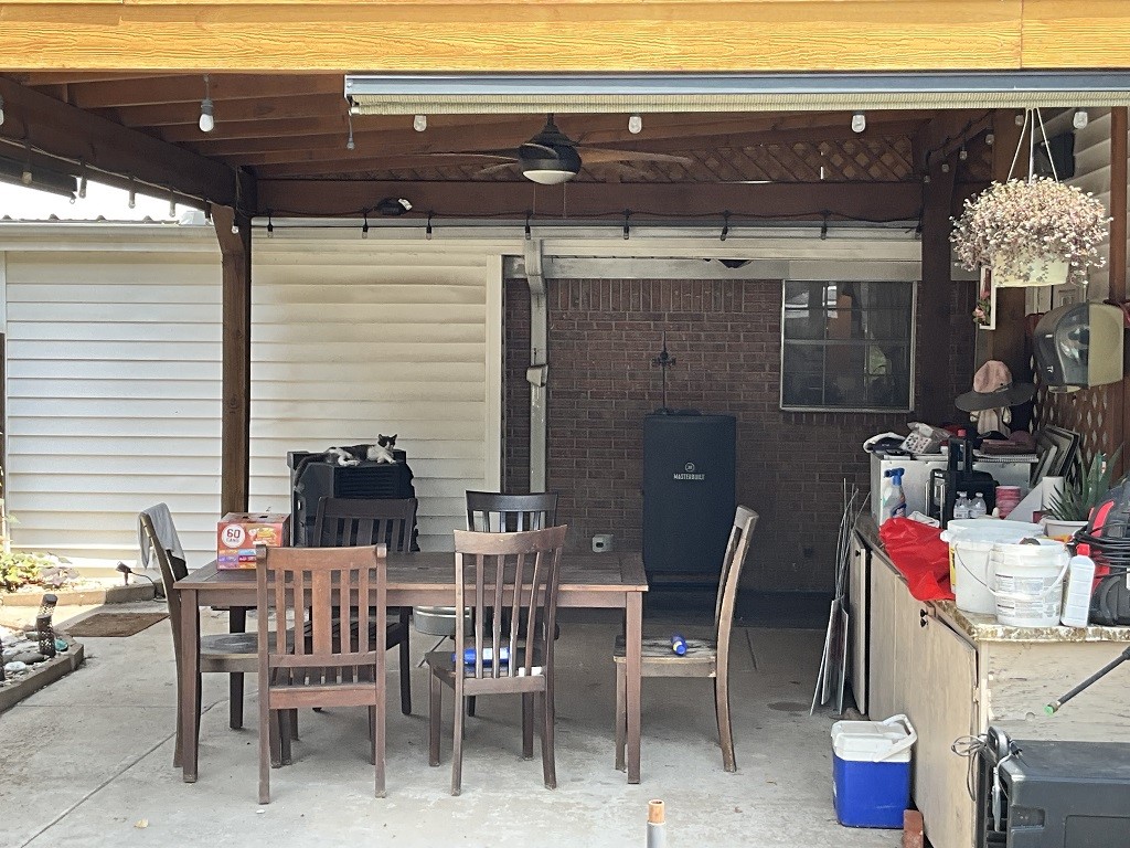 416 Division Street Jewett, TX 75846 - Photo 29 of 36 a view of a patio with table and chairs and potted plants