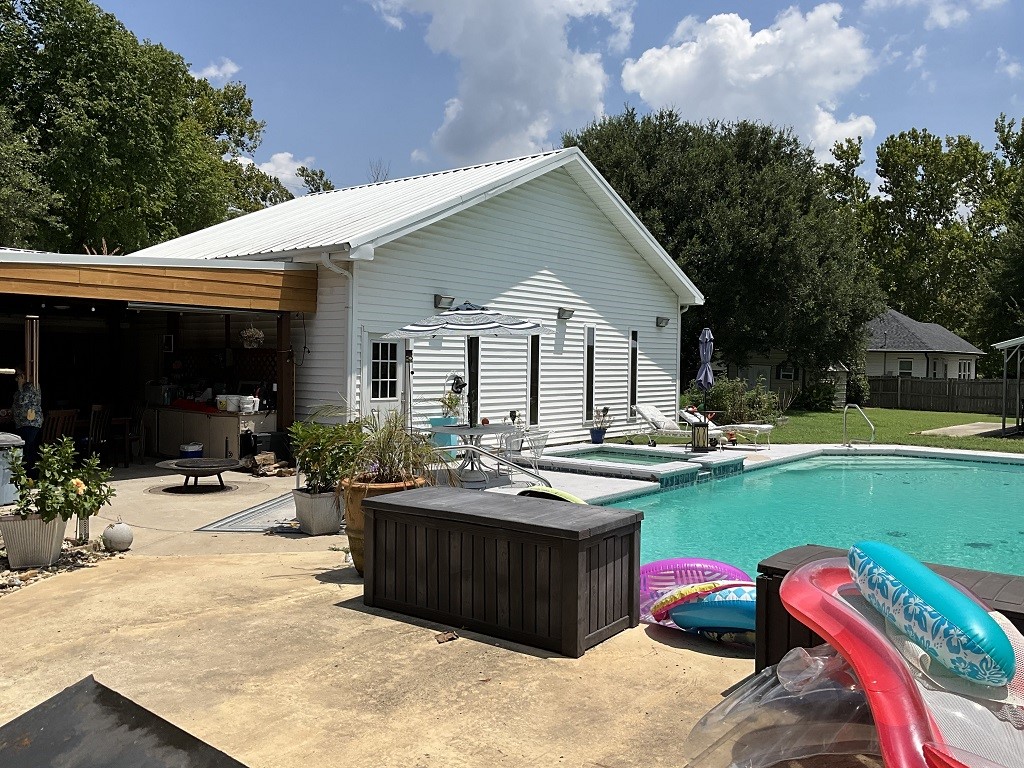 416 Division Street Jewett, TX 75846 - Photo 30 of 36 a view of a house with swimming pool and sitting area