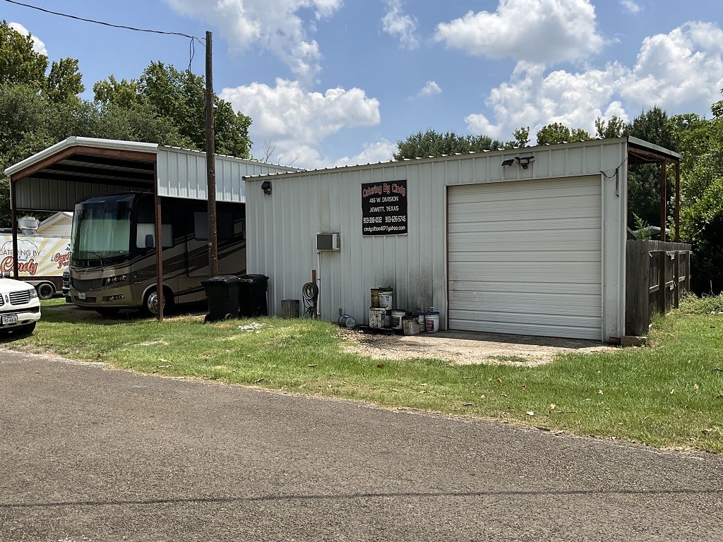 416 Division Street Jewett, TX 75846 - Photo 31 of 36 a backyard of a house with barbeque oven and outdoor seating