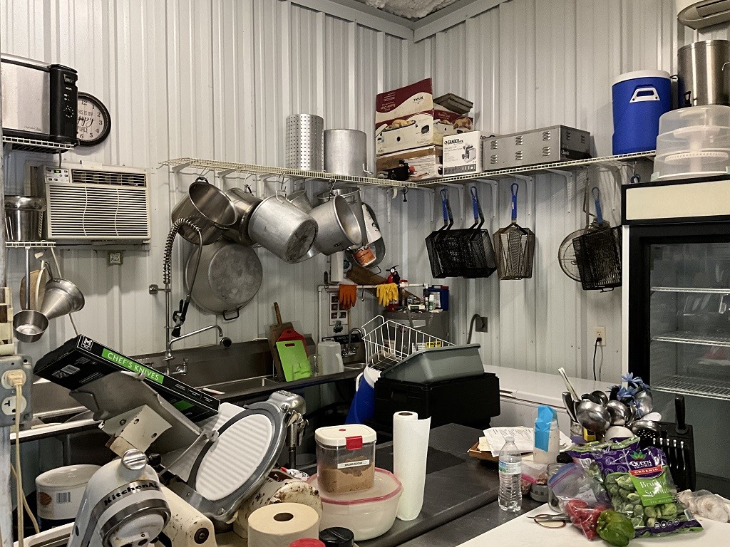 416 Division Street Jewett, TX 75846 - Photo 33 of 36 a kitchen with stainless steel appliances granite countertop a sink and a stove