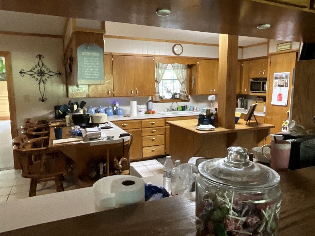 416 Division Street Jewett, TX 75846 - Photo 8 of 36 a kitchen with a sink and cabinets