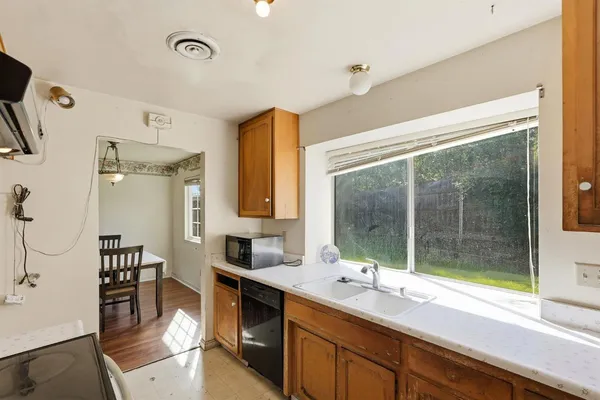 a view of kitchen with window and wooden floor