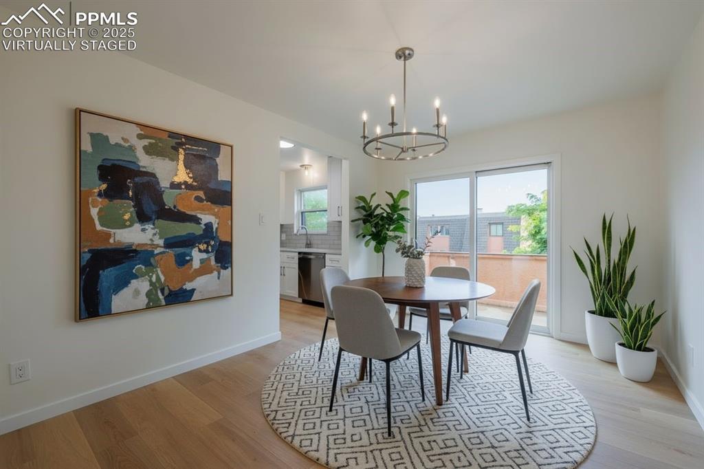2905 Mesa Road, Unit D Colorado Springs, CO 80904 - Photo 15 of 34 a view of a dining room with furniture window and wooden floor