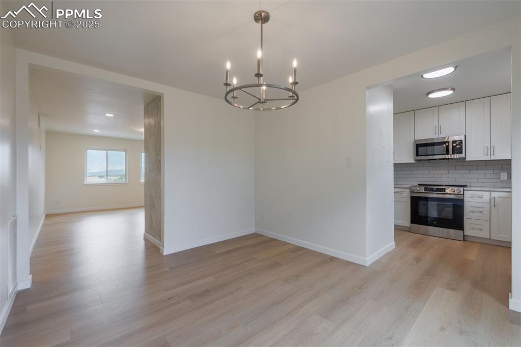 2905 Mesa Road, Unit D Colorado Springs, CO 80904 - Photo 18 of 34 a view of a kitchen with a sink wooden floor and a kitchen counter top