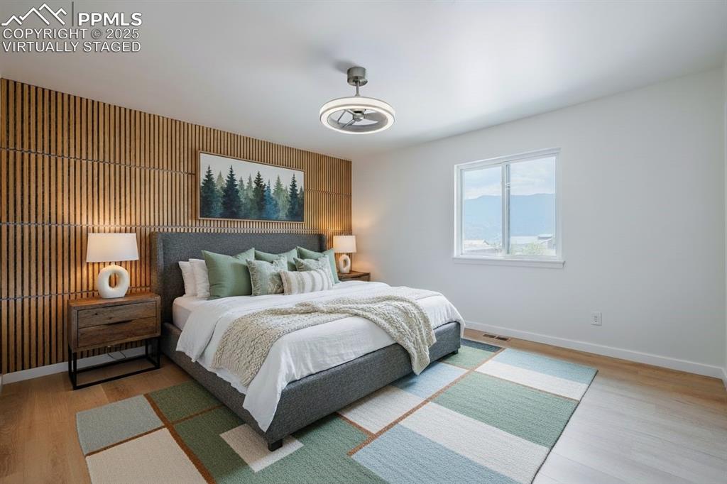 2905 Mesa Road, Unit D Colorado Springs, CO 80904 - Photo 19 of 34 a bedroom with a bed and a window