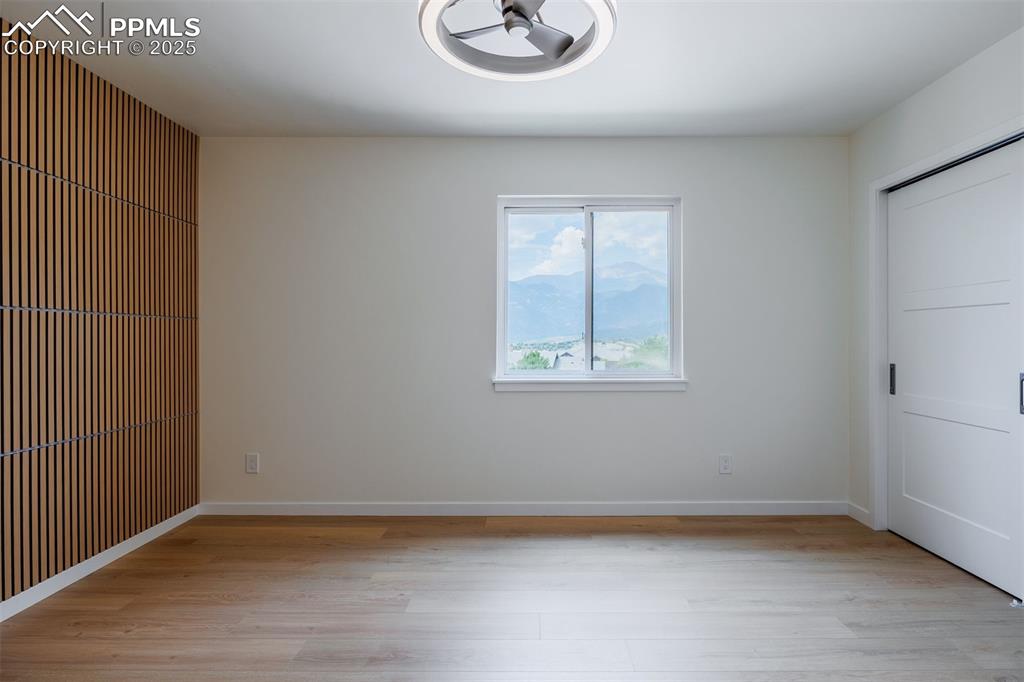 2905 Mesa Road, Unit D Colorado Springs, CO 80904 - Photo 21 of 34 an empty room with wooden floor and windows