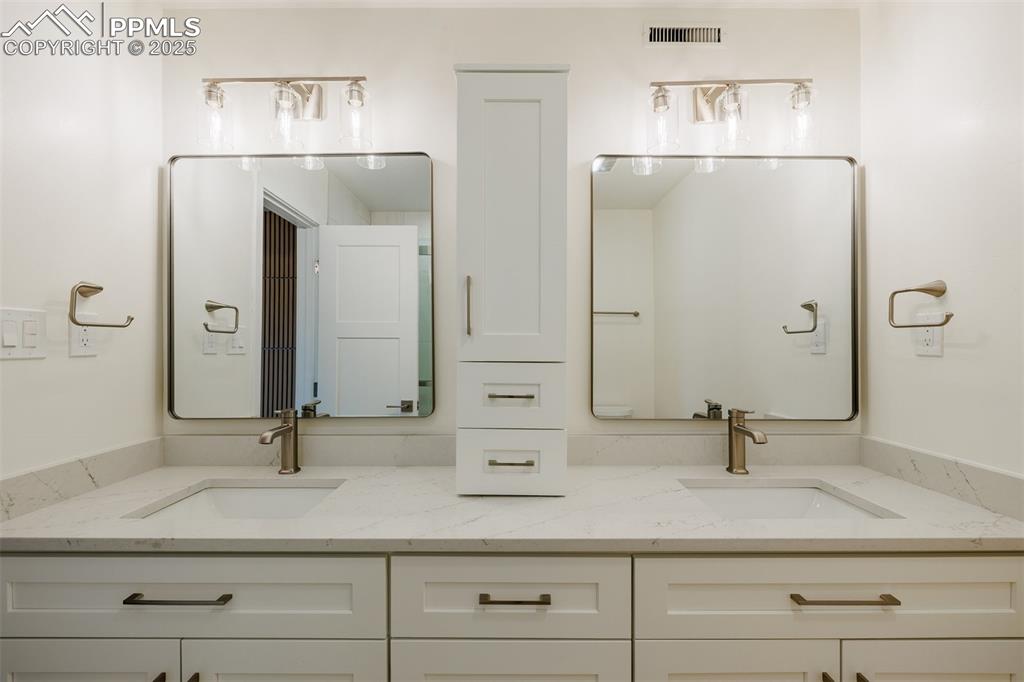 2905 Mesa Road, Unit D Colorado Springs, CO 80904 - Photo 26 of 34 a bathroom with a sink and mirror