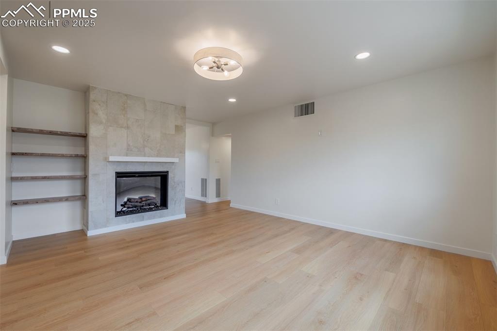 2905 Mesa Road, Unit D Colorado Springs, CO 80904 - Photo 8 of 34 a view of an empty room with a fireplace
