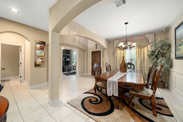 a view of a livingroom with furniture and a chandelier
