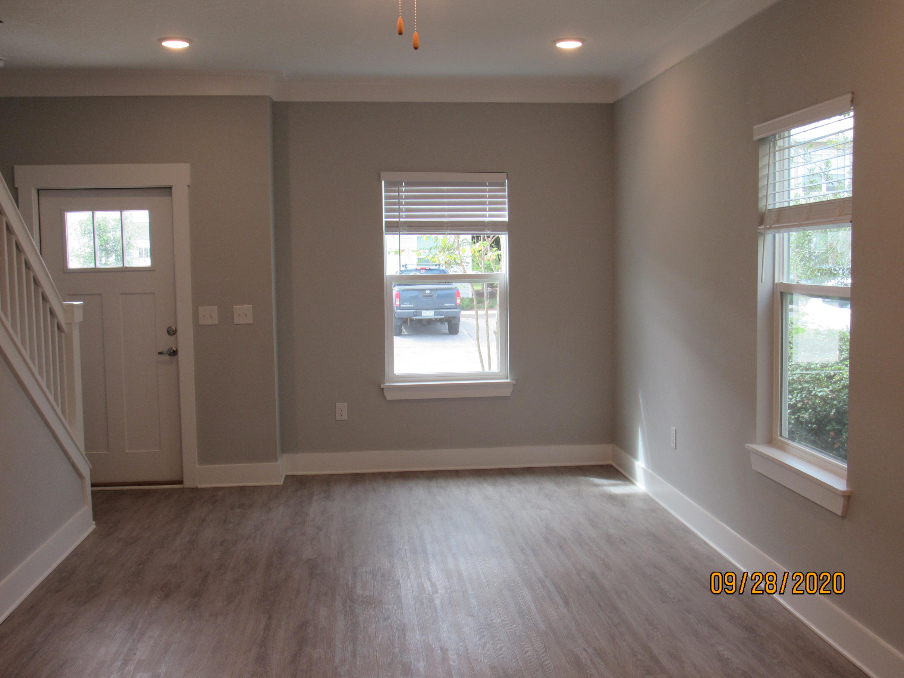 45 South Sand Palm Road Freeport, FL 32439 - Photo 5 of 19 a view of an empty room with wooden floor and a window