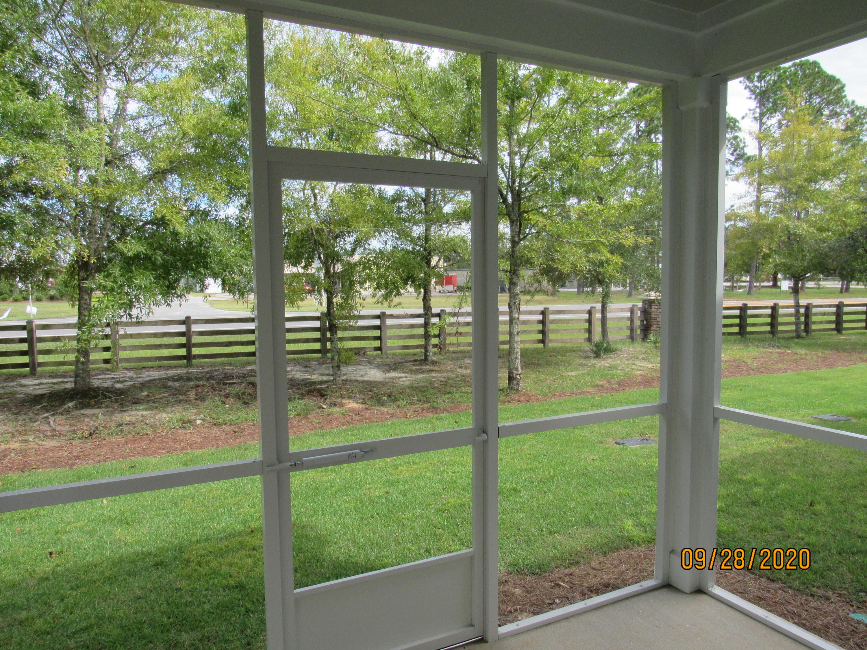45 South Sand Palm Road Freeport, FL 32439 - Photo 7 of 19 a view of backyard with large trees and a small yard