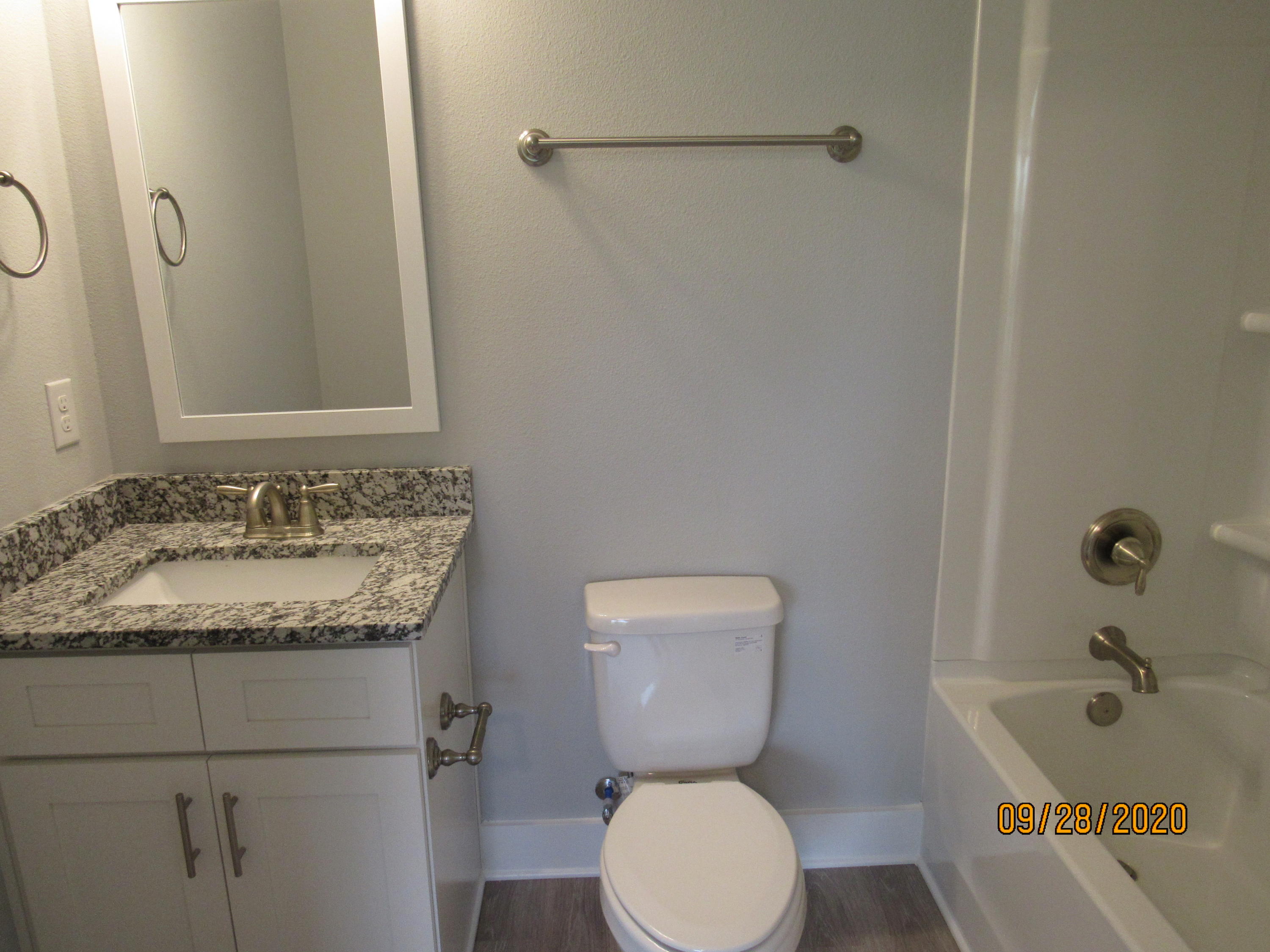 45 South Sand Palm Road Freeport, FL 32439 - Photo 10 of 19 a bathroom with a granite countertop toilet sink and mirror