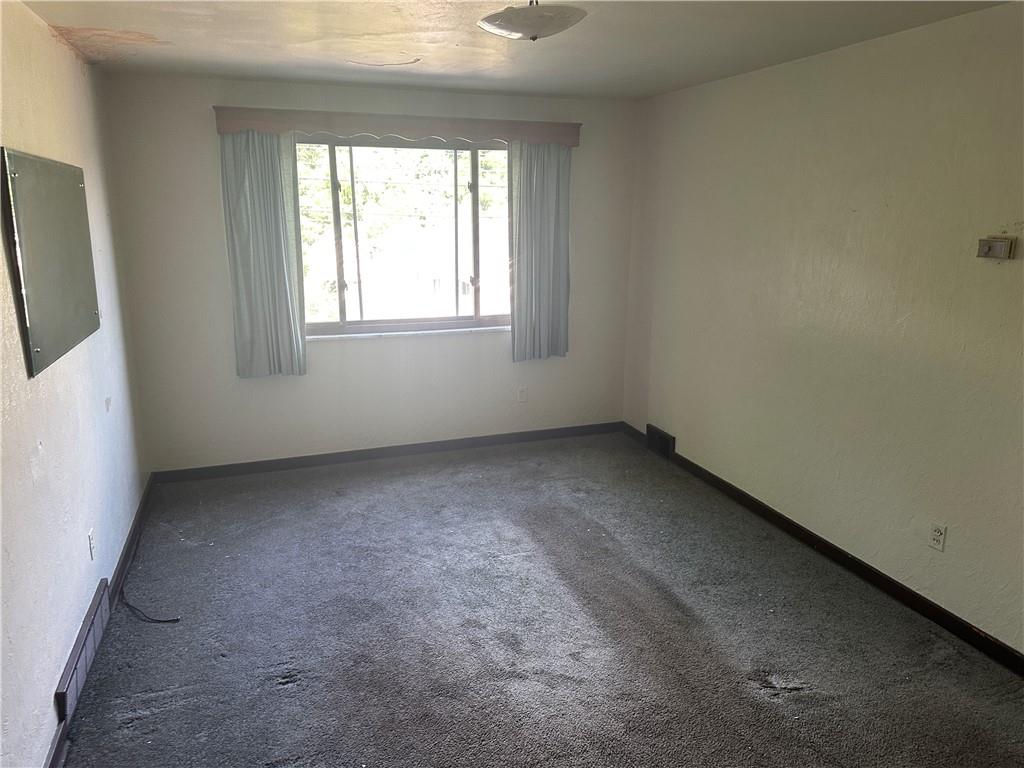 998 Chartiers Avenue Carnegie, PA 15106 - Photo 2 of 10 an empty room with a window