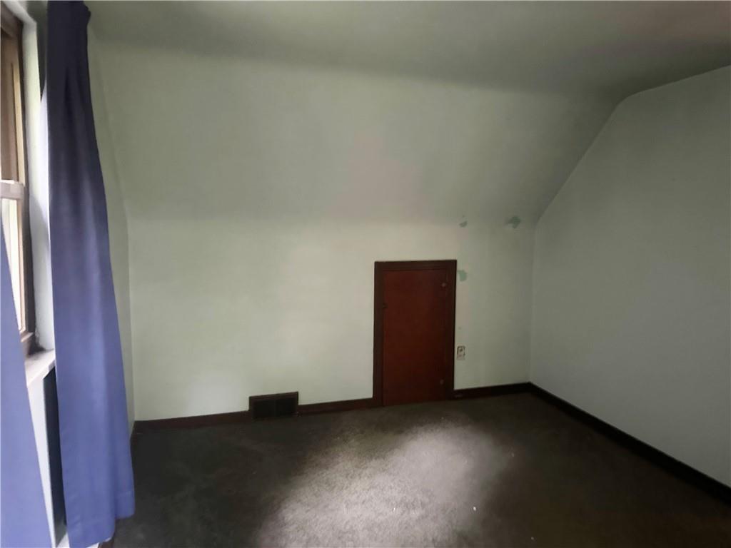 998 Chartiers Avenue Carnegie, PA 15106 - Photo 8 of 10 a view of an empty room and wooden floor