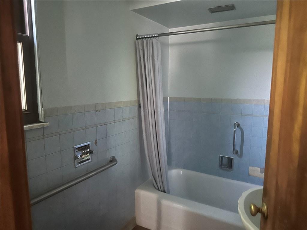 998 Chartiers Avenue Carnegie, PA 15106 - Photo 9 of 10 a bathroom with a bathtub and a shower