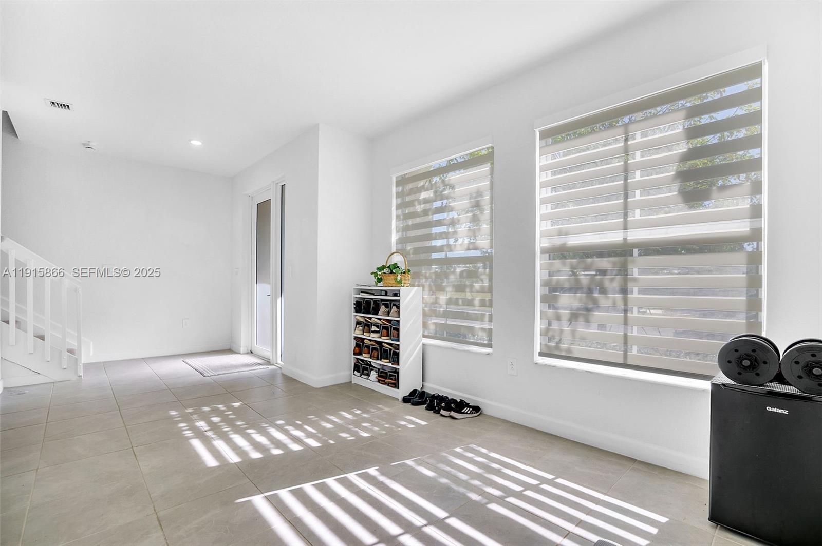 12859 Southwest 243rd Terrace Homestead, FL 33032 - Photo 13 of 38 a view of an empty room with a window